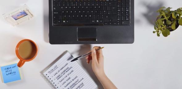 preparing to apply with laptop and notepad